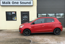 Red 2019 Mitsubishi Mirage with professional window tint at Maik One Sound